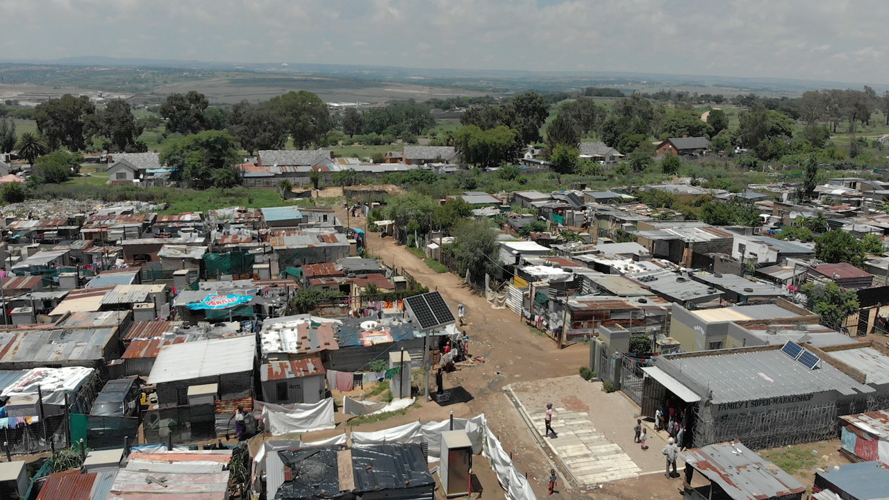 Arial of a solar tower off grid low voltage distribution in Diepsloot, South Africa