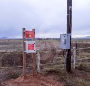 External electrical DB boxes with warning signage for the installed hybrid solar power system in Porterville Western Cape  