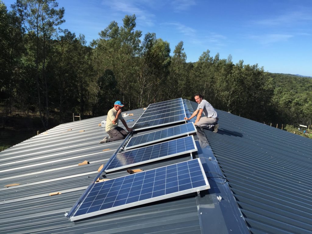 solar panels on roof, technicians