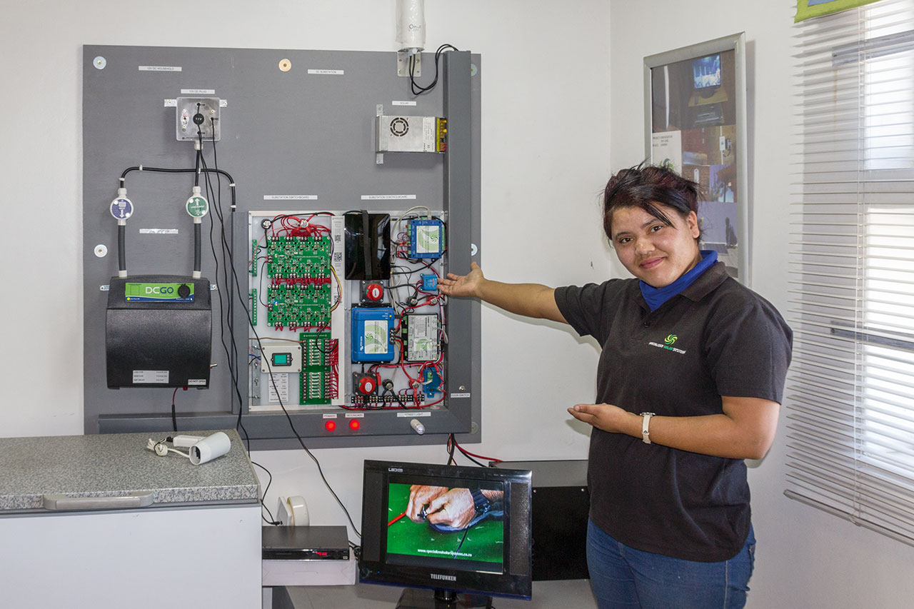 Elisma Prins presents Solar tower (off-grid DC Microgrid) testing rig for software testing in Andrew Behrens office (Software Management)