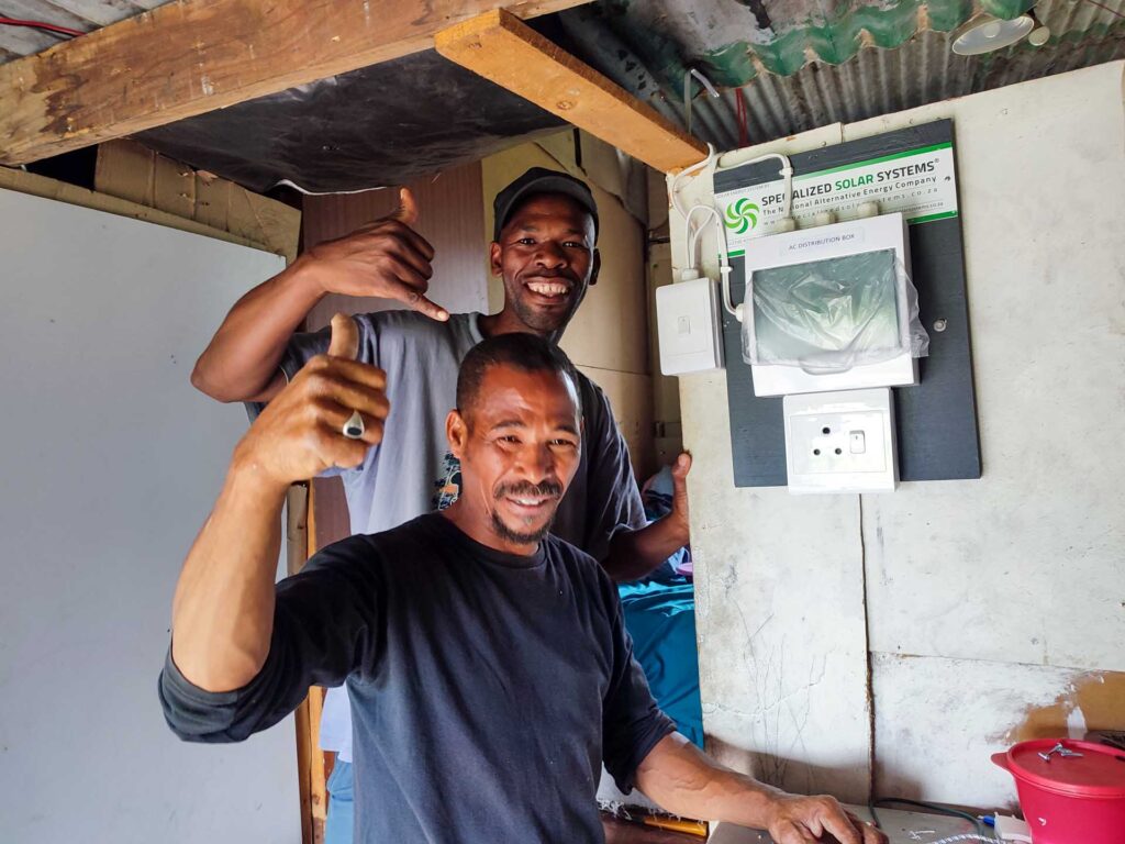 The first installation of a distribution board installed at the Thembalethu AC Solar Electrification Pilot Project 