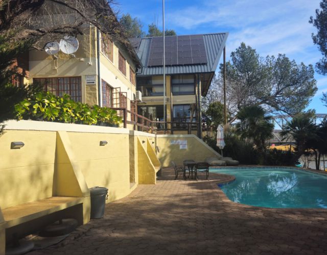 Solar arrays installed across multiple rooftops at Riverside Lodge in Aliwal North