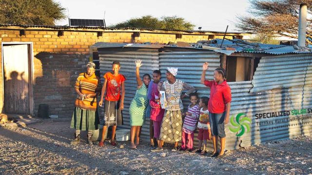 Community members enjoying their new solar microgrids in